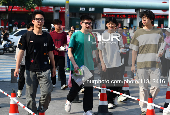 Candidates are lining up to enter a test room to take the National college entrance examination at a college entrance examination site in Fu...