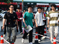 Candidates are lining up to enter a test room to take the National college entrance examination at a college entrance examination site in Fu...