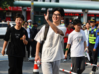 Candidates are lining up to enter a test room to take the National college entrance examination at a college entrance examination site in Fu...