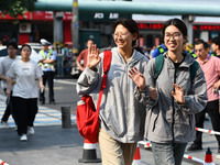 Candidates are lining up to enter a test room to take the National college entrance examination at a college entrance examination site in Fu...