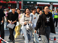 Candidates are lining up to enter a test room to take the National college entrance examination at a college entrance examination site in Fu...