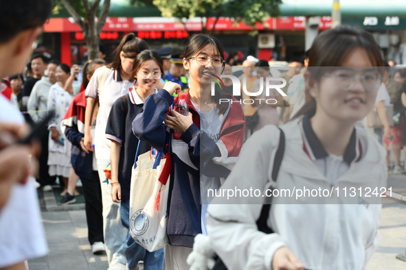 Candidates are lining up to enter a test room to take the National college entrance examination at a college entrance examination site in Fu...