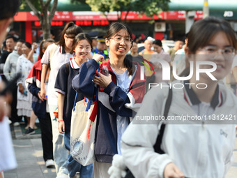 Candidates are lining up to enter a test room to take the National college entrance examination at a college entrance examination site in Fu...