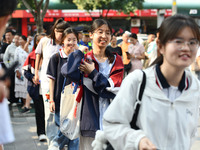 Candidates are lining up to enter a test room to take the National college entrance examination at a college entrance examination site in Fu...