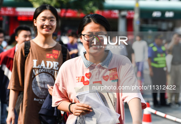 Candidates are lining up to enter a test room to take the National college entrance examination at a college entrance examination site in Fu...