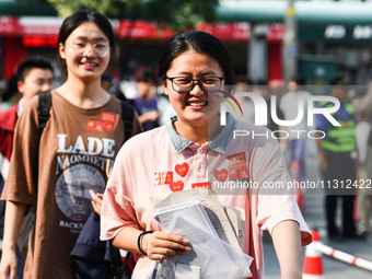 Candidates are lining up to enter a test room to take the National college entrance examination at a college entrance examination site in Fu...