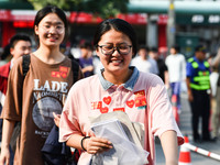 Candidates are lining up to enter a test room to take the National college entrance examination at a college entrance examination site in Fu...