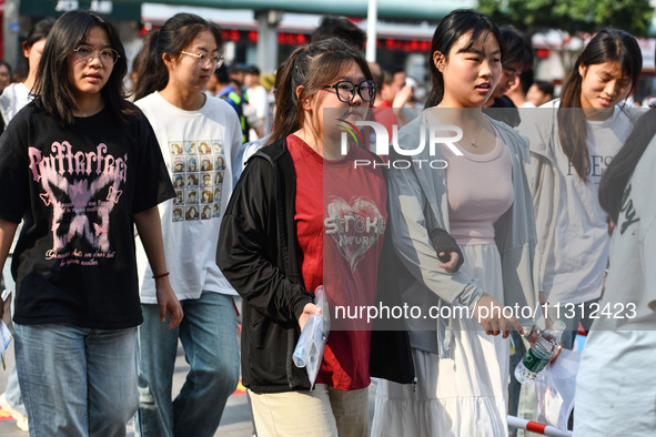 Candidates are lining up to enter a test room to take the National college entrance examination at a college entrance examination site in Fu...