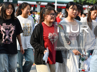 Candidates are lining up to enter a test room to take the National college entrance examination at a college entrance examination site in Fu...