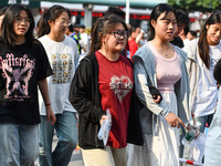 Candidates are lining up to enter a test room to take the National college entrance examination at a college entrance examination site in Fu...