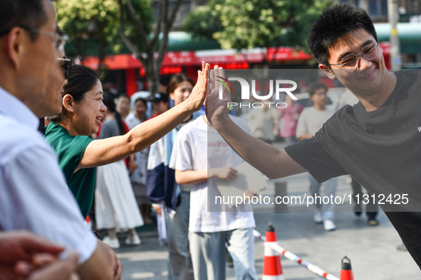 Candidates are lining up to enter a test room to take the National college entrance examination at a college entrance examination site in Fu...