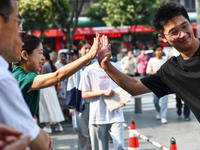 Candidates are lining up to enter a test room to take the National college entrance examination at a college entrance examination site in Fu...