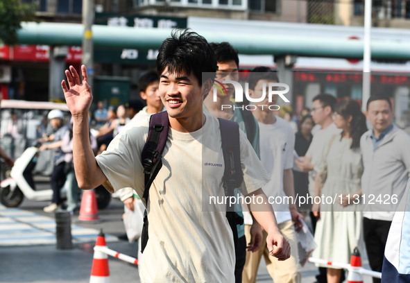 Candidates are lining up to enter a test room to take the National college entrance examination at a college entrance examination site in Fu...