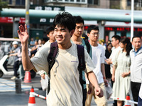 Candidates are lining up to enter a test room to take the National college entrance examination at a college entrance examination site in Fu...