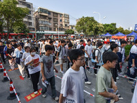 Candidates are lining up to enter a test room to take the National college entrance examination at a college entrance examination site in Fu...