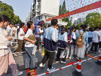 Candidates are lining up to enter a test room to take the National college entrance examination at a college entrance examination site in Fu...