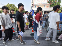 Candidates are lining up to enter a test room to take the National college entrance examination at a college entrance examination site in Fu...