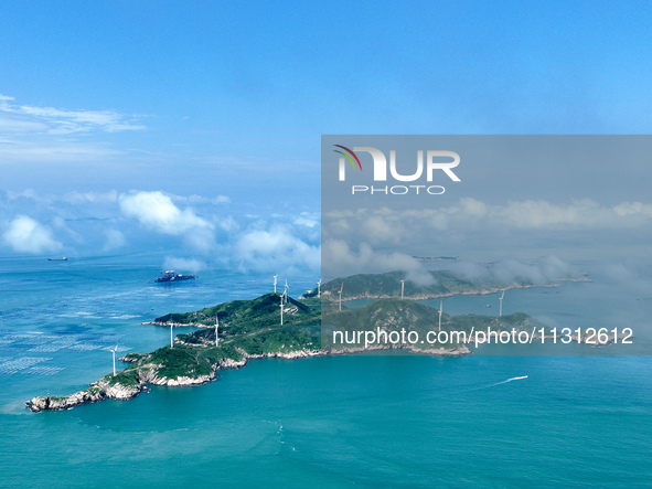 A wind farm is being seen on Luhua Island in Zhoushan city, Zhejiang province, China, on June 8, 2024. June 8, 2024, is World Oceans Day. 