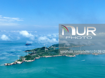 A wind farm is being seen on Luhua Island in Zhoushan city, Zhejiang province, China, on June 8, 2024. June 8, 2024, is World Oceans Day. (