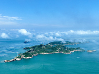 A wind farm is being seen on Luhua Island in Zhoushan city, Zhejiang province, China, on June 8, 2024. June 8, 2024, is World Oceans Day. (