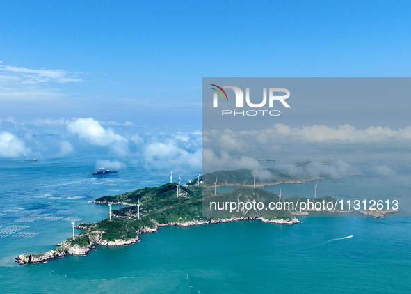 A wind farm is being seen on Luhua Island in Zhoushan city, Zhejiang province, China, on June 8, 2024. June 8, 2024, is World Oceans Day. 