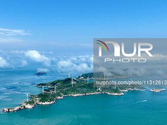 A wind farm is being seen on Luhua Island in Zhoushan city, Zhejiang province, China, on June 8, 2024. June 8, 2024, is World Oceans Day. (