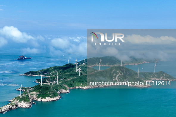 A wind farm is being seen on Luhua Island in Zhoushan city, Zhejiang province, China, on June 8, 2024. June 8, 2024, is World Oceans Day. 