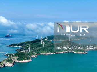 A wind farm is being seen on Luhua Island in Zhoushan city, Zhejiang province, China, on June 8, 2024. June 8, 2024, is World Oceans Day. (