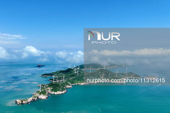 A wind farm is being seen on Luhua Island in Zhoushan city, Zhejiang province, China, on June 8, 2024. June 8, 2024, is World Oceans Day. 