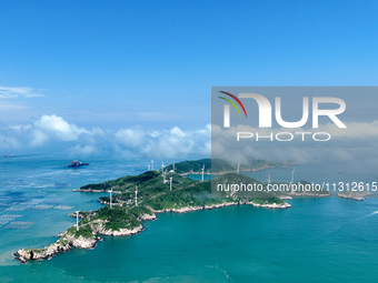 A wind farm is being seen on Luhua Island in Zhoushan city, Zhejiang province, China, on June 8, 2024. June 8, 2024, is World Oceans Day. (