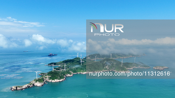 A wind farm is being seen on Luhua Island in Zhoushan city, Zhejiang province, China, on June 8, 2024. June 8, 2024, is World Oceans Day. 