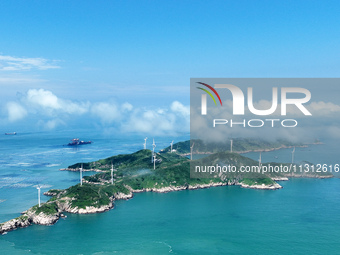 A wind farm is being seen on Luhua Island in Zhoushan city, Zhejiang province, China, on June 8, 2024. June 8, 2024, is World Oceans Day. (