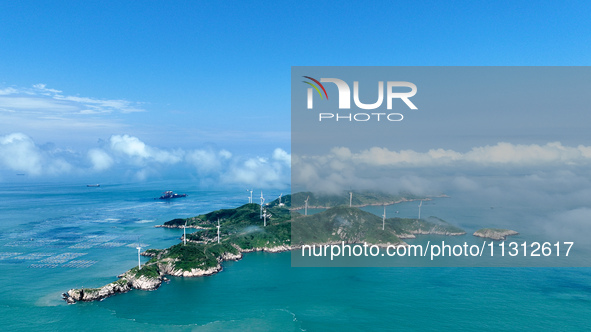 A wind farm is being seen on Luhua Island in Zhoushan city, Zhejiang province, China, on June 8, 2024. June 8, 2024, is World Oceans Day. 