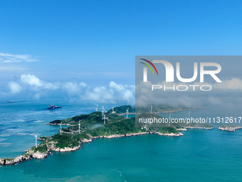 A wind farm is being seen on Luhua Island in Zhoushan city, Zhejiang province, China, on June 8, 2024. June 8, 2024, is World Oceans Day. (