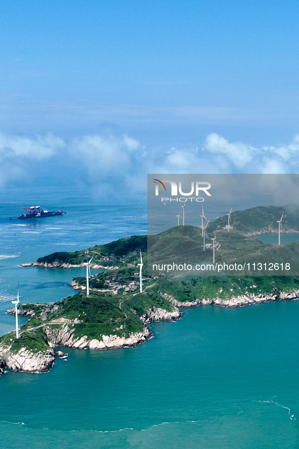 A wind farm is being seen on Luhua Island in Zhoushan city, Zhejiang province, China, on June 8, 2024. June 8, 2024, is World Oceans Day. 