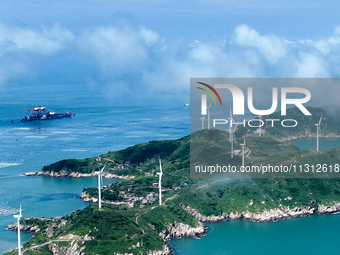 A wind farm is being seen on Luhua Island in Zhoushan city, Zhejiang province, China, on June 8, 2024. June 8, 2024, is World Oceans Day. (