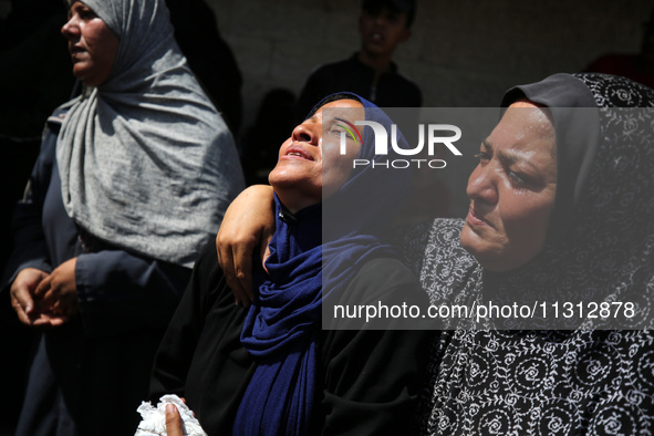 Palestinian women are mourning the death of loved ones following Israeli bombardment, outside a hospital in Deir el-Balah in the central Gaz...