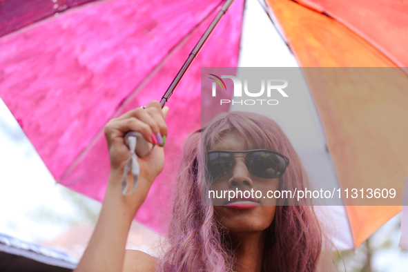 A member of the Nepali sexual minority group, commonly called the LGBTIQ+, is posing for a photo while attending the 6th Nepal Pride Parade...