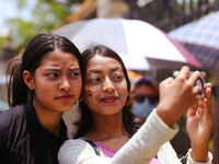 Participants are taking a selfie while attending the 6th Nepal Pride Parade in Kathmandu, Nepal, on June 8, 2024. Hundreds of members of mar...