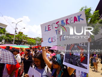 Participants are taking part in the annual Nepal Pride Parade in Kathmandu, Nepal, on June 8, 2024. Hundreds of members of marginalized sexu...