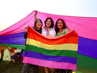 Participants are displaying the pride flag while taking part in the annual Nepal Pride Parade in Kathmandu, Nepal, on June 8, 2024. Hundreds...