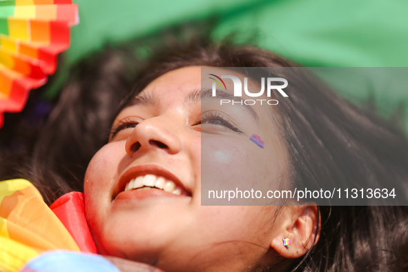 A participant is taking part in the annual Nepal Pride Parade in Kathmandu, Nepal, on June 8, 2024. Hundreds of members of marginalized sexu...