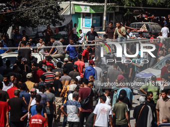 Mourners are reacting during the funeral of Palestinians killed in Israeli strikes, amid the Israel-Hamas conflict, in Deir Al-Balah, in cen...