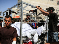 Mourners are reacting during the funeral of Palestinians killed in Israeli strikes, amid the Israel-Hamas conflict, in Deir Al-Balah, in cen...