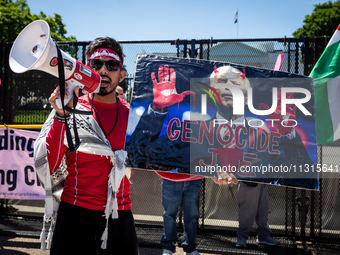 A protester holds a poster of 'Genocide Joe' as thousands of pro-Palestinian demonstrators encircle the White House, forming a ‘red line’ to...