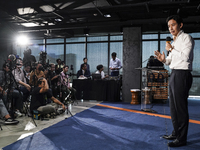 Former leader of the Move Forward Party Pita Limjaroenrat is answering questions from the media during a press conference on the party's pla...