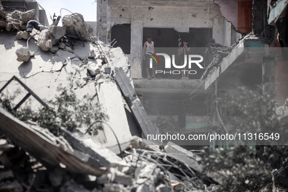 Palestinians are inspecting the damage and debris a day after an operation by the Israeli Special Forces in the Nuseirat camp, in the centra...