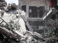 Palestinians are inspecting the damage and debris a day after an operation by the Israeli Special Forces in the Nuseirat camp, in the centra...