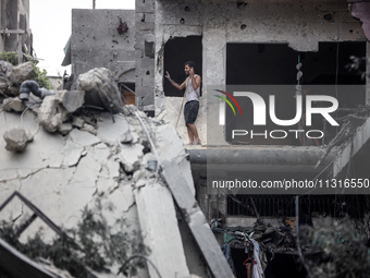 Palestinians are inspecting the damage and debris a day after an operation by the Israeli Special Forces in the Nuseirat camp, in the centra...