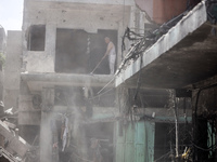 Palestinians are inspecting the damage and debris a day after an operation by the Israeli Special Forces in the Nuseirat camp, in the centra...